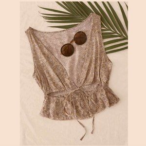 Plunging Neck Tie Front Ditsy Floral Peplum Top